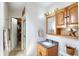 Bathroom featuring vanity with sink and enclosed shower with open closet at 110 Jordan Ct, Martinsville, IN 46151
