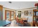 Eat-in kitchen featuring a wood dining table, natural light, and hardwood floors at 110 Jordan Ct, Martinsville, IN 46151