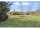 Charming stone home with well-maintained lawn and mature trees at 110 Jordan Ct, Martinsville, IN 46151