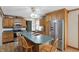Well-equipped kitchen with wood cabinetry, stainless steel appliances, and a functional island at 110 Jordan Ct, Martinsville, IN 46151