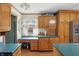Cozy kitchen featuring wood cabinets, a desk area, and stainless steel appliances at 110 Jordan Ct, Martinsville, IN 46151