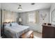 Bedroom featuring a queen bed, wood furniture, and white walls at 110 Jordan Ct, Martinsville, IN 46151