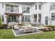 Expansive backyard with a pergola covered sitting area and an outdoor dining space, perfect for entertaining at 11003 Holliday Farms Blvd, Zionsville, IN 46077