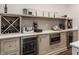 Bar area featuring a wine rack, beverage fridge, microwave and tiled backsplash at 11003 Holliday Farms Blvd, Zionsville, IN 46077