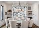 Elegant dining room with a round table, seating for eight, decorative lighting, and an open floor plan at 11003 Holliday Farms Blvd, Zionsville, IN 46077