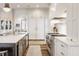 Well-equipped kitchen featuring a large island, stainless steel appliances, and convenient breakfast bar at 11003 Holliday Farms Blvd, Zionsville, IN 46077