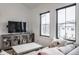 Cozy living room area with large windows, and neutral colored decor and furniture at 11003 Holliday Farms Blvd, Zionsville, IN 46077