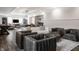 Spacious living room with a modern design, game room, with lots of seating, and natural light at 11003 Holliday Farms Blvd, Zionsville, IN 46077