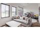 Comfortable living room area with large windows, comfortable sofa, and modern furnishings at 11003 Holliday Farms Blvd, Zionsville, IN 46077