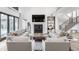 Bright living room with soaring ceilings, fireplace, and comfortable seating for relaxing and entertaining guests at 11003 Holliday Farms Blvd, Zionsville, IN 46077