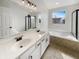 Bright bathroom with a double vanity, soaking tub, and a separate glass-enclosed shower at 11063 Deer Valley Dr, Indianapolis, IN 46229