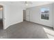 Bright bedroom with neutral walls, carpet, a ceiling fan, and a window offering natural light at 11063 Deer Valley Dr, Indianapolis, IN 46229