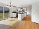 Modern kitchen featuring white cabinetry, an island, and sliding glass doors to the backyard at 11063 Deer Valley Dr, Indianapolis, IN 46229