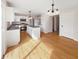 Well-lit kitchen with hardwood floors, stainless steel appliances, and a large island at 11063 Deer Valley Dr, Indianapolis, IN 46229