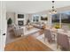 Inviting living room with a fireplace, large windows, and a seamless flow to the dining area at 11063 Deer Valley Dr, Indianapolis, IN 46229
