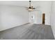 Spacious main bedroom with a ceiling fan and adjacent bathroom and walk-in closet at 11063 Deer Valley Dr, Indianapolis, IN 46229