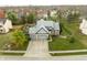 Lovely neighborhood featuring a home with a two-car garage, green lawn, and mature trees at 11229 Echo Ridge Ln, Indianapolis, IN 46236