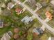 Aerial view of neighborhood homes with well-manicured lawns, mature trees and street access at 11229 Echo Ridge Ln, Indianapolis, IN 46236