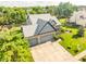 Lovely aerial view shows the home, driveway, and meticulously kept landscaping at 11229 Echo Ridge Ln, Indianapolis, IN 46236