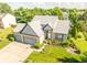 Stunning aerial view of home with lush green landscaping and spacious driveway at 11229 Echo Ridge Ln, Indianapolis, IN 46236