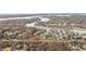 Panoramic aerial of homes with lake access; boat docks, a variety of amenities and natural landscaping at 11229 Echo Ridge Ln, Indianapolis, IN 46236