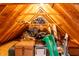 Finished attic featuring exposed wood beams and ample storage space at 11229 Echo Ridge Ln, Indianapolis, IN 46236