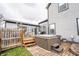 Backyard featuring a hot tub, deck area, and gray siding at 11229 Echo Ridge Ln, Indianapolis, IN 46236