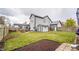 Spacious backyard with a shed, fire pit, hot tub, and well-maintained lawn at 11229 Echo Ridge Ln, Indianapolis, IN 46236