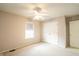 Bedroom with carpet, ceiling fan, a closet and window for natural light at 11229 Echo Ridge Ln, Indianapolis, IN 46236