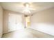 Bedroom with carpet, ceiling fan, and double door closet for storage at 11229 Echo Ridge Ln, Indianapolis, IN 46236