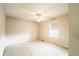 Bedroom with carpet, ceiling fan, and window for natural light at 11229 Echo Ridge Ln, Indianapolis, IN 46236