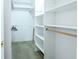 Well-organized walk-in closet with shelving and hanging space for efficient storage at 11229 Echo Ridge Ln, Indianapolis, IN 46236