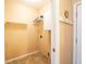 Walk-in closet featuring built-in shelving and hanging rods for ample storage at 11229 Echo Ridge Ln, Indianapolis, IN 46236