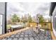 An outdoor deck with a hot tub and seating area, perfect for relaxation at 11229 Echo Ridge Ln, Indianapolis, IN 46236