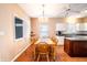 Inviting dining room featuring a wooden table, chairs, and ample natural light at 11229 Echo Ridge Ln, Indianapolis, IN 46236