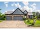Charming brick home with two-car garage and well-maintained landscaping at 11229 Echo Ridge Ln, Indianapolis, IN 46236
