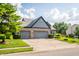 Charming home featuring a large driveway and mature trees at 11229 Echo Ridge Ln, Indianapolis, IN 46236