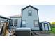 Back of house featuring a hot tub, deck, and newly painted siding at 11229 Echo Ridge Ln, Indianapolis, IN 46236