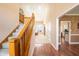Inviting hallway with wood floors, leading to a bright living room with abundant natural light at 11229 Echo Ridge Ln, Indianapolis, IN 46236