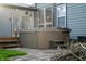 Back of house featuring a hot tub, patio, deck, and access to back door at 11229 Echo Ridge Ln, Indianapolis, IN 46236