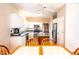 Bright kitchen with white cabinetry, stainless appliances, and a tiled dining table at 11229 Echo Ridge Ln, Indianapolis, IN 46236