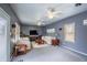 Spacious living room with neutral walls, comfortable seating, and entertainment center at 11229 Echo Ridge Ln, Indianapolis, IN 46236