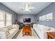 Well-lit living space with comfortable seating, entertainment setup, and neutral decor at 11229 Echo Ridge Ln, Indianapolis, IN 46236