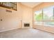 Bright living room with a fireplace and large window at 11229 Echo Ridge Ln, Indianapolis, IN 46236