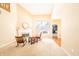 Spacious living area with fireplace, neutral tones, and view into adjacent rooms at 11229 Echo Ridge Ln, Indianapolis, IN 46236