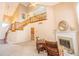 Bright living room with high ceilings, fireplace and staircase leading to the second floor at 11229 Echo Ridge Ln, Indianapolis, IN 46236