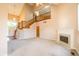 Bright living room with staircase, fireplace, and neutral walls at 11229 Echo Ridge Ln, Indianapolis, IN 46236