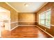 Bright living room featuring hardwood floors, neutral paint, and a large window at 11229 Echo Ridge Ln, Indianapolis, IN 46236