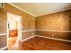 Inviting living room with hardwood floors and view into the kitchen area at 11229 Echo Ridge Ln, Indianapolis, IN 46236