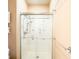 Bathroom featuring a glass sliding door shower, a toilet and storage cabinet at 11229 Echo Ridge Ln, Indianapolis, IN 46236